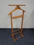 A wrought iron wall hanging plant trough together with a valet stand