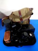 A tray containing camera bag containing Zenit 11 camera,