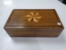 An antique inlaid trinket box with flower embroidery insert