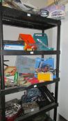 Four shelves of workshop tools and sundries including a 