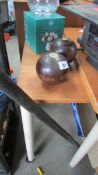 Two lawn bowls and a snooker cue case.