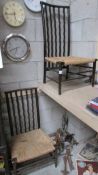 A pair of rattan seated nursing chairs.