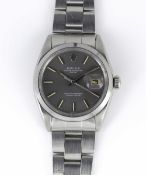 A GENTLEMAN'S STAINLESS STEEL ROLEX OYSTER PERPETUAL DATE BRACELET WATCH CIRCA 1969, REF. 1500