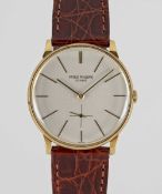 A GENTLEMAN'S 18K SOLID GOLD PATEK PHILIPPE CALATRAVA WRIST WATCH CIRCA 1960s, REF. 2573-2