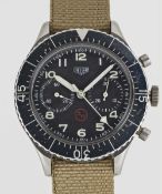 A GENTLEMAN'S STAINLESS STEEL GERMAN MILITARY HEUER BUND FLYBACK CHRONOGRAPH WRIST WATCH CIRCA 1970,