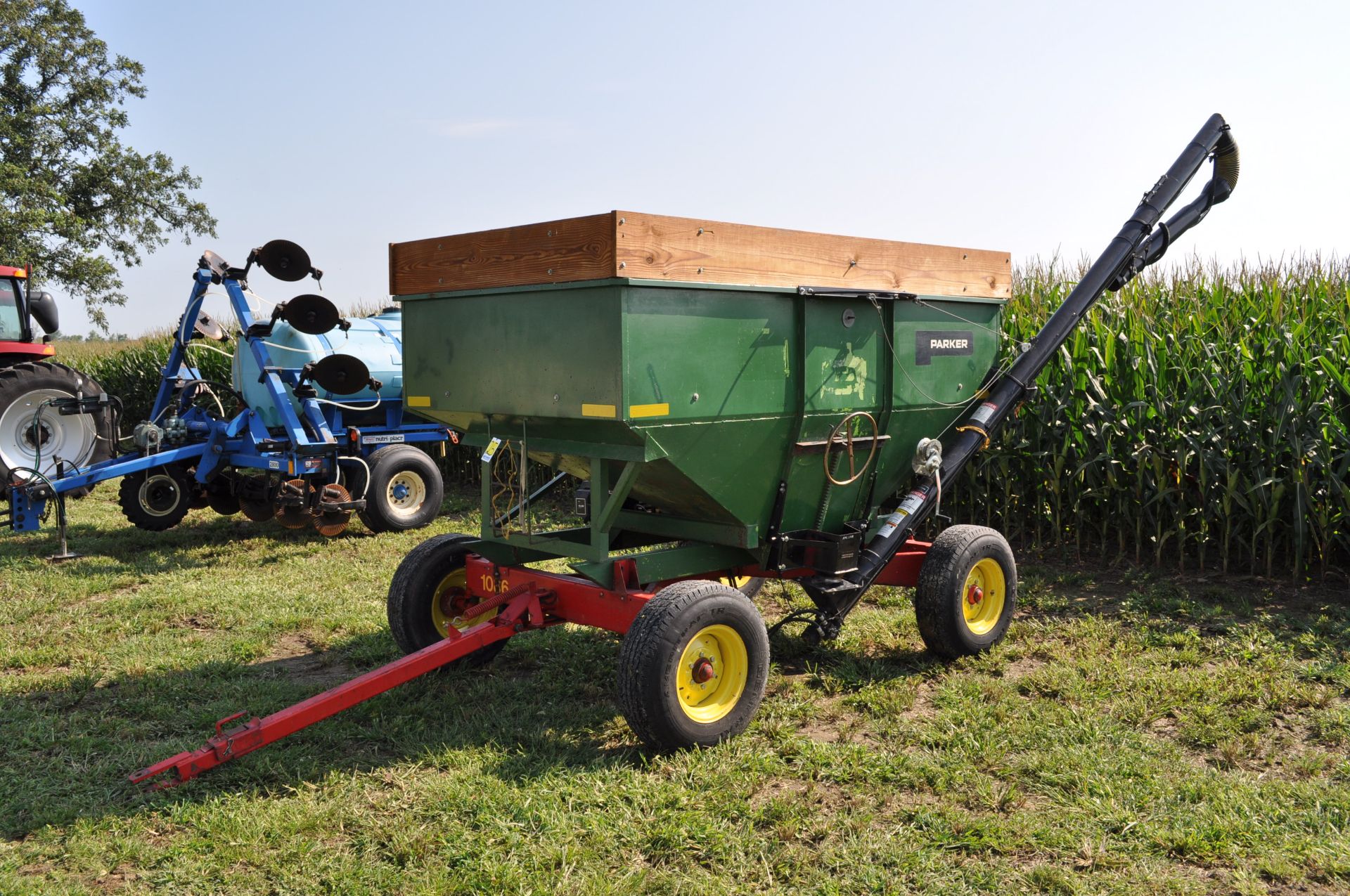 Parker 200 bu gravity seed wagon, 15’ J&M poly cup seed auger, Pequa 1086 gear, 16” tires