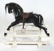 Edwardian black painted wooden rocking horse