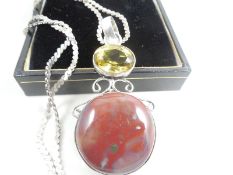 Silver necklace with pendant.