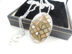 Silver necklace with mother of pearl pendant.