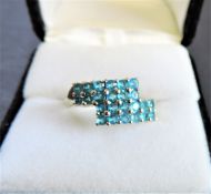 Sterling Silver Ring set with 24 Blue Topaz Gemstones
