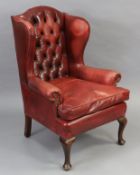 Edwardian button back leather wing back armchair with cabriole legs