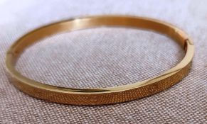 Cartier style yellow metal bangle