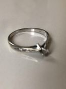 0.10 Ct. diamond ring with diamond shoulders set in 9 kt gold
