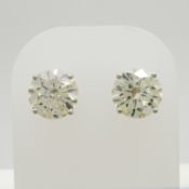 Large pair of dazzling 4.12 carat round, brilliant-cut diamond solitaire studs in 18ct white gold