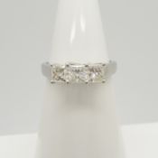 This is an 18ct white gold trilogy ring set with 1.00 carats of princess-cut diamonds.