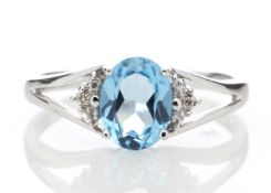 9k White Gold Diamond And Blue Topaz Ring