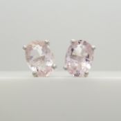 A pair of morganite and silver ear studs