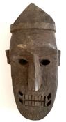 Vintage African Wood Tribal Mask     Vintage African Wood Tribal Mask.Measures 12 inches long.. Part