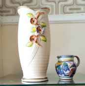 A small Poole Pottery jug together with a large Arthur Wood vase.