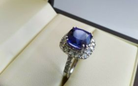 8.94ct Tanzanite surrounded by 1.71ct Diamonds, set in 18ct White Gold Ring