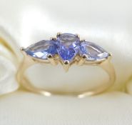 9 Kt Three stone gold ring set with Tanzanite