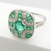 A stylish emerald and diamond Art Deco-styled panel ring in platinum