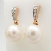A stylish pair of 9ct rose gold, diamond pearl drop earrings, boxed