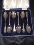 A set of six Edwardian Hanoverian scroll back coffee spoons.