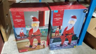 (7P) 2x Skiing Santa Light Mains Operated RRP £25 Each.