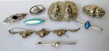A selection of seven silver based brooches, one necklace and two others