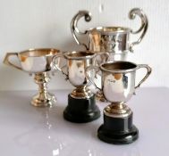 An Edwardian silver two-handled trophy cup on a stepped base by Mappin & Webb, London, 1905, 14 h