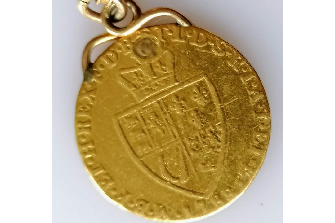 A George III gold sovereign, 1788, 8.6g on a gold chain, tests for gold, 9.65g. (total weight 18. - Image 2 of 2