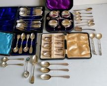 A cased Victorian set of four silver salts with beaded rims, hoof feet and conforming spoons by