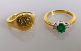 An oval emerald (6mm x 4mm) and diamond ring on yellow gold with an initialled signet gold ring,