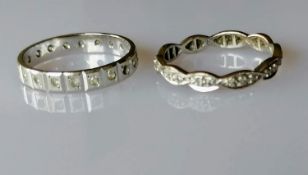 A white gold eternity ring, size P, hallmarked 750, 2.95g and another, size Q, hallmarked 585, 2.5g,