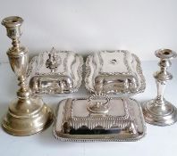 A pair of Victorian silver plated entree dishes with rococo decoration, (both with twist on