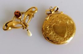 An Art Nouveau citrine and pearl brooch with an etched pendant locket, both on 9ct yellow gold and