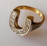 A mid-century yellow and white gold horseshoe-shape ring with pave-set diamond decoration,