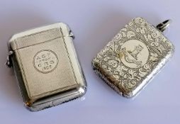 A late Victorian silver vesta case with engine turned decoration and dedication, another with
