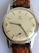 A 1960's men's Omega manual wristwatch with baton and Arabic numeral markers, subsidiary seconds