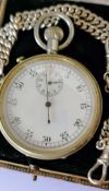 A cased military issue nickel-cased lever split second stopwatch with Arabic numerals and subsidiary