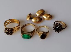 Four gem-set 9ct gold rings, various sizes and a pair of cufflinks with seed pearl decoration (one