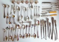 A miscellany of silver flatware to include souvenir spoons, forks, knives, button hooks, bottle