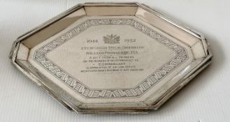 An Art Deco silver octagonal presentation tray with shaped rim and isometric border decoration to
