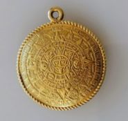 A highly decorated Aztec-style gold pendant, 30mm diameter, stamped 18K, 15.21g