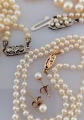 A mid-century choker string of pearls with gold clasp, stamped 15ct and a closely matching pair of