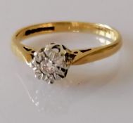 An illusion-set diamond ring with a 0.05 carat brilliant-cut diamond, colour/clarity H-I, I1, size