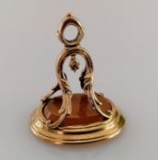A Georgian oval intaglio fob seal depicting a carved head with trident, unmarked, 30mm h x 25mm x