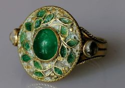 An Oriental gold ring with cabochon and moonstone decoration, unmarked, size O, 4.36g