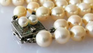 A two-row necklet of one hundred and seventy-three (89, 84) uniform cultured pearls, 6mm to 6.6mm on